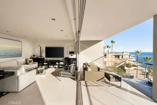a living room with lots of furniture and a flat screen tv