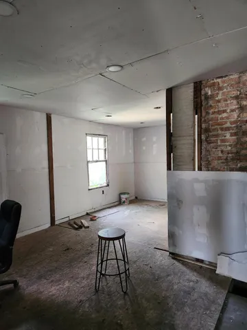 a view of a livingroom with furniture and window