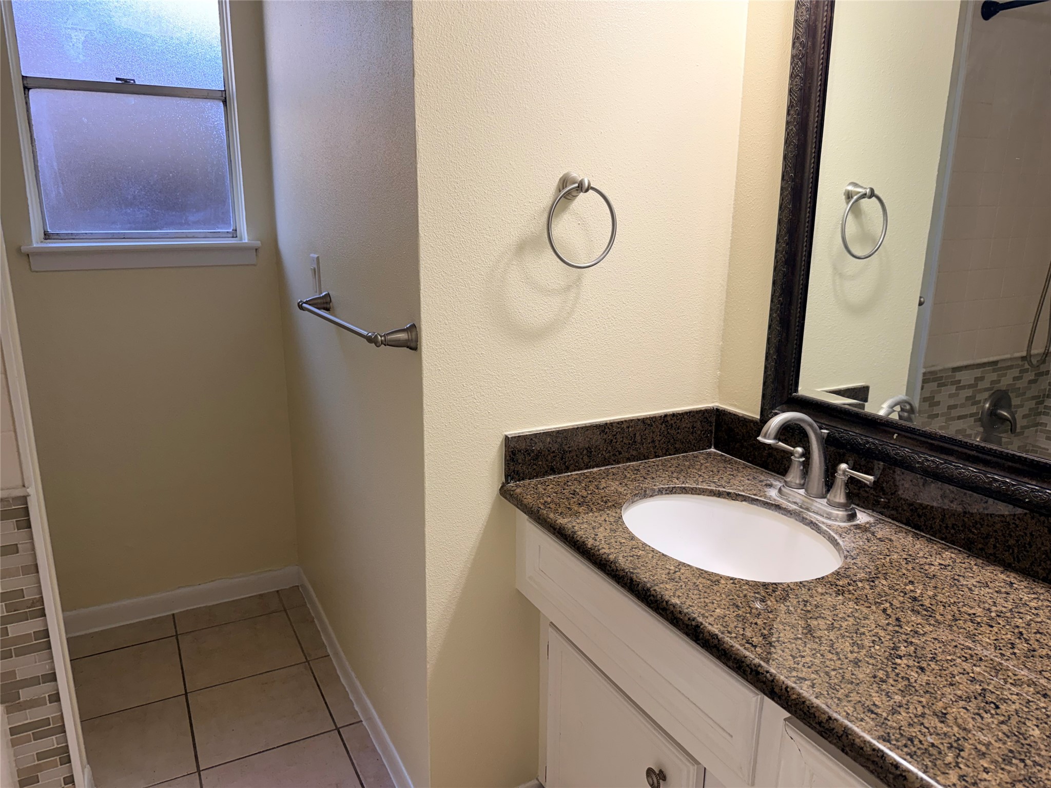 2439 Meandering Trail Houston, TX 77339 - Photo 7 of 8 a bathroom with a granite countertop sink and a mirror