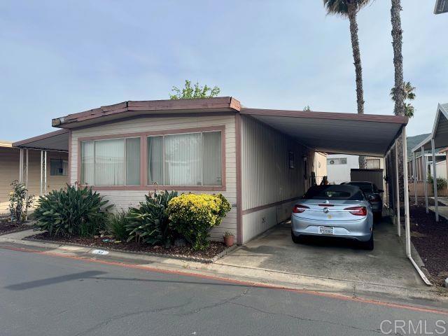 8301 Mission Gorge Road, Unit 54 Santee, CA 92071 - Photo 2 of 24 a car parked in front of a house
