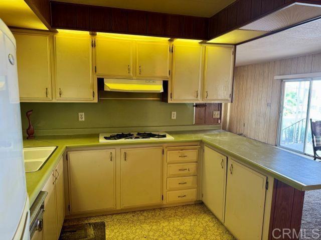8301 Mission Gorge Road, Unit 54 Santee, CA 92071 - Photo 4 of 24 a kitchen with a sink and a large window