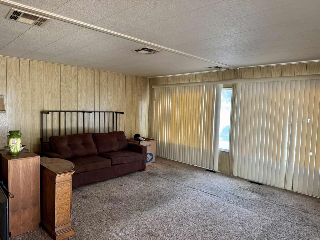 8301 Mission Gorge Road, Unit 54 Santee, CA 92071 - Photo 5 of 24 a living room with furniture and a window