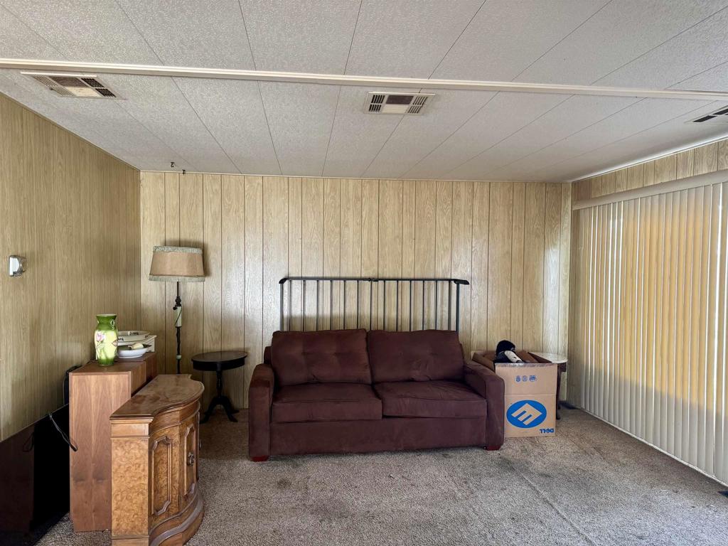 8301 Mission Gorge Road, Unit 54 Santee, CA 92071 - Photo 7 of 24 a bedroom with a bed and a window