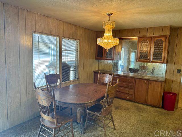 8301 Mission Gorge Road, Unit 54 Santee, CA 92071 - Photo 10 of 24 a dining room with a table and chairs