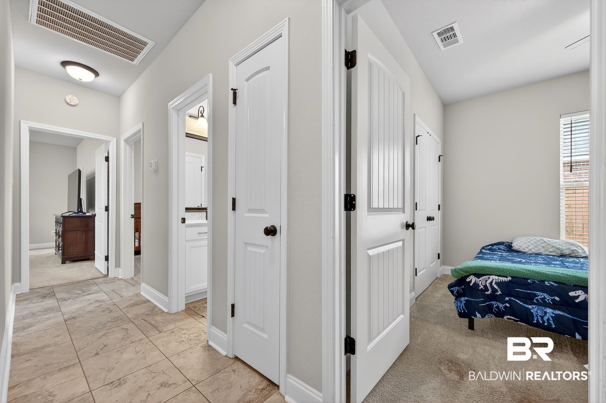 1084 Stella Road Foley, AL 36535 - Photo 23 of 31 Hallway featuring baseboards and light colored carpet