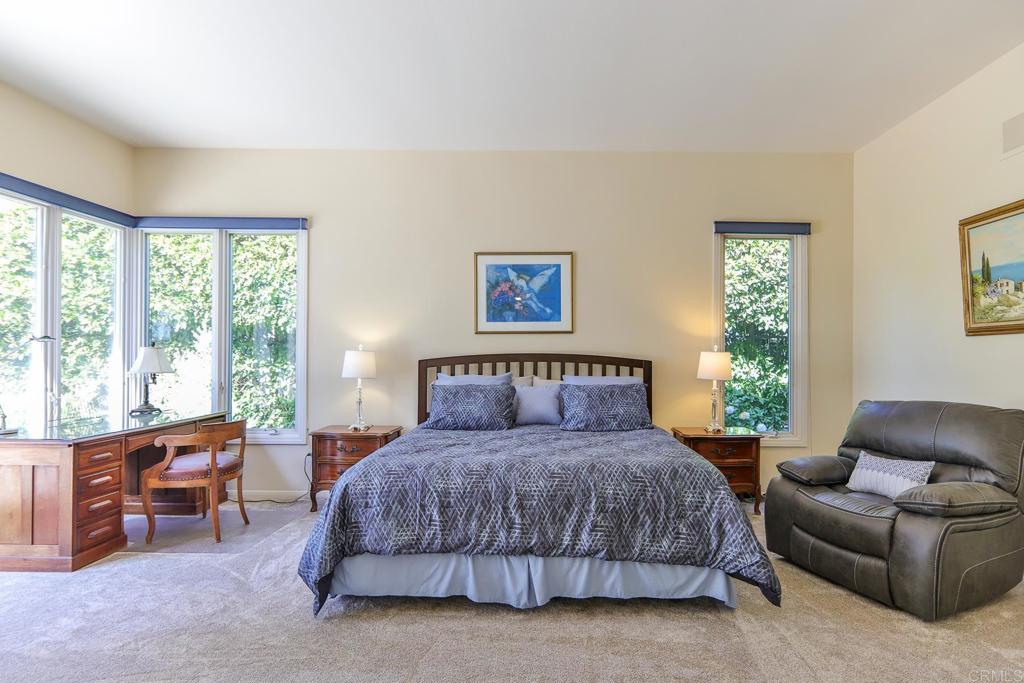 7163 Tern Place Carlsbad, CA 92011 - Photo 17 of 48 a bedroom with a large bed and a couch