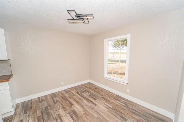a bedroom with bed and window