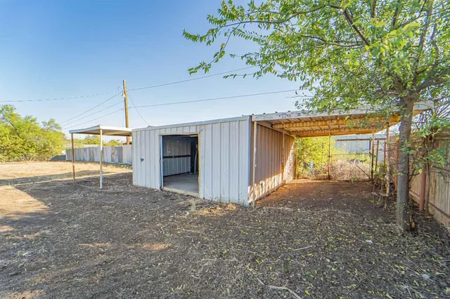 a view of a backyard of a house