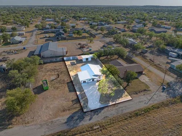 an aerial view of residential building with parking space