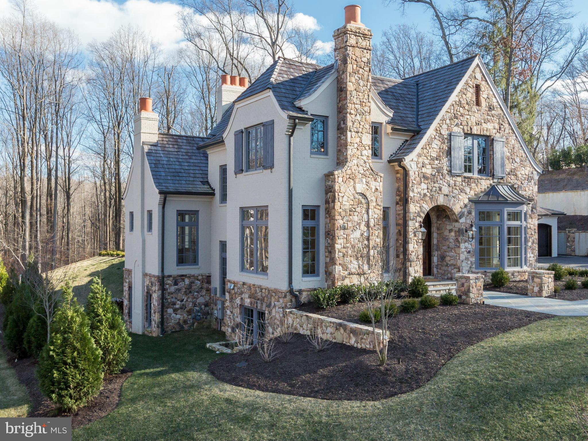 821 Turkey Run Road McLean, VA 22101 - Photo 2 of 30 a view of a white house with a yard and plants