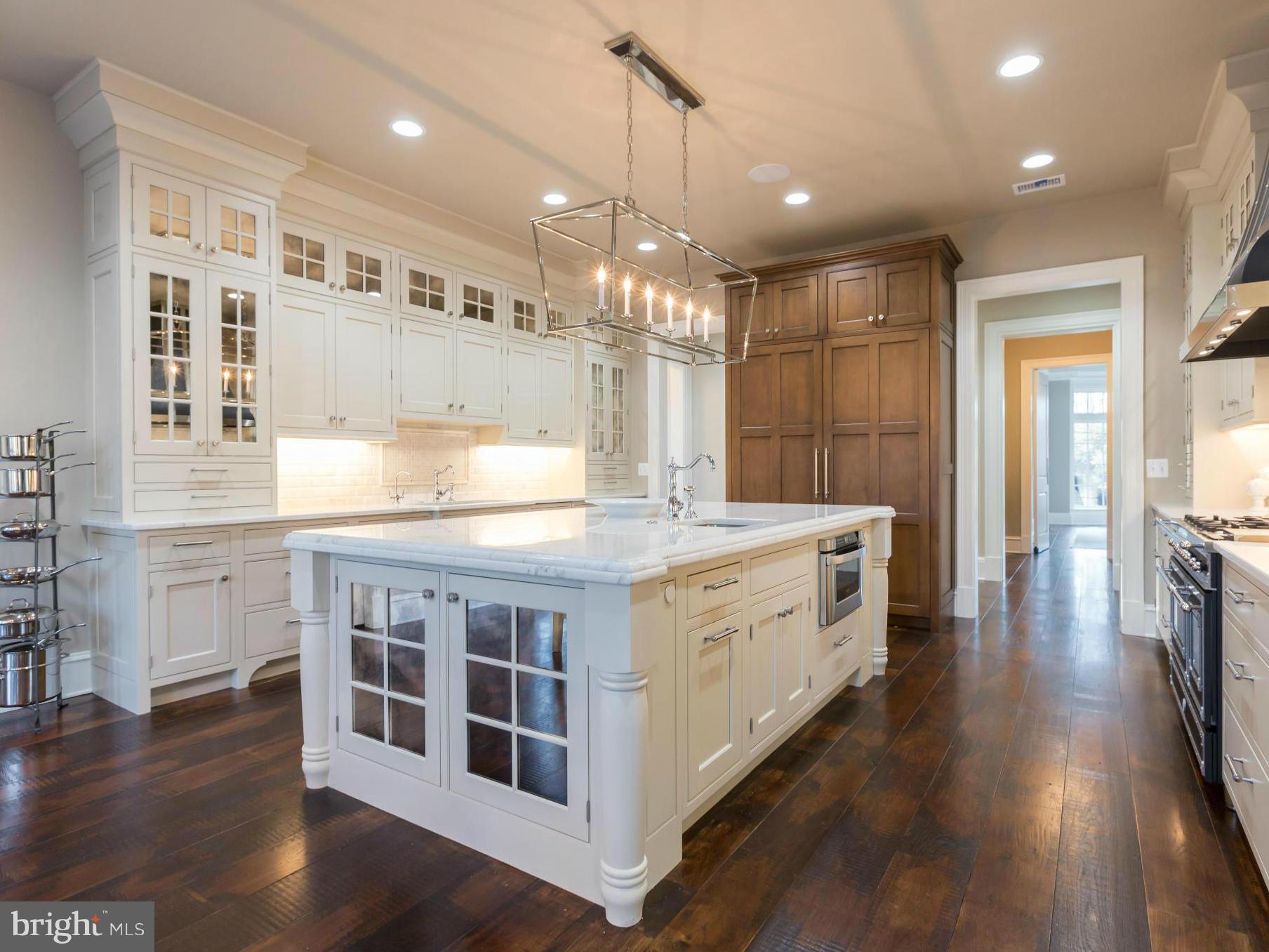821 Turkey Run Road McLean, VA 22101 - Photo 11 of 30 a bathroom with a double vanity sink and a large mirror