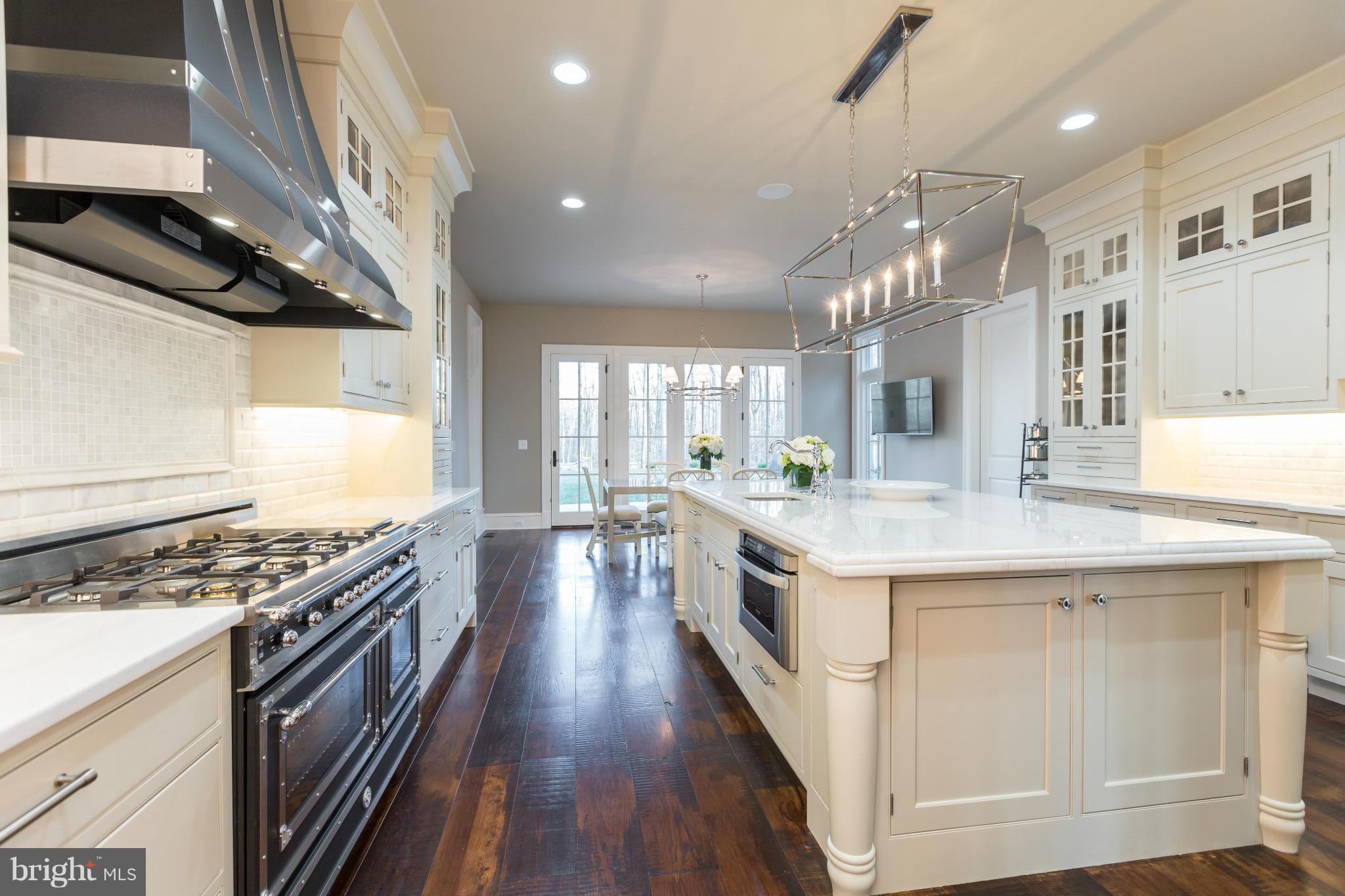 821 Turkey Run Road McLean, VA 22101 - Photo 14 of 30 a kitchen with stove and wooden floor