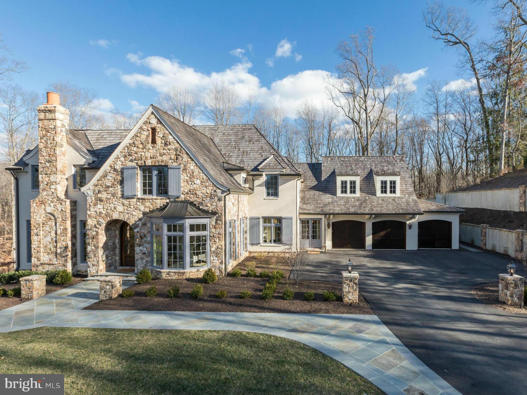 821 Turkey Run Road McLean, VA 22101 - Photo 3 of 30 a view of a white house with a yard and plants