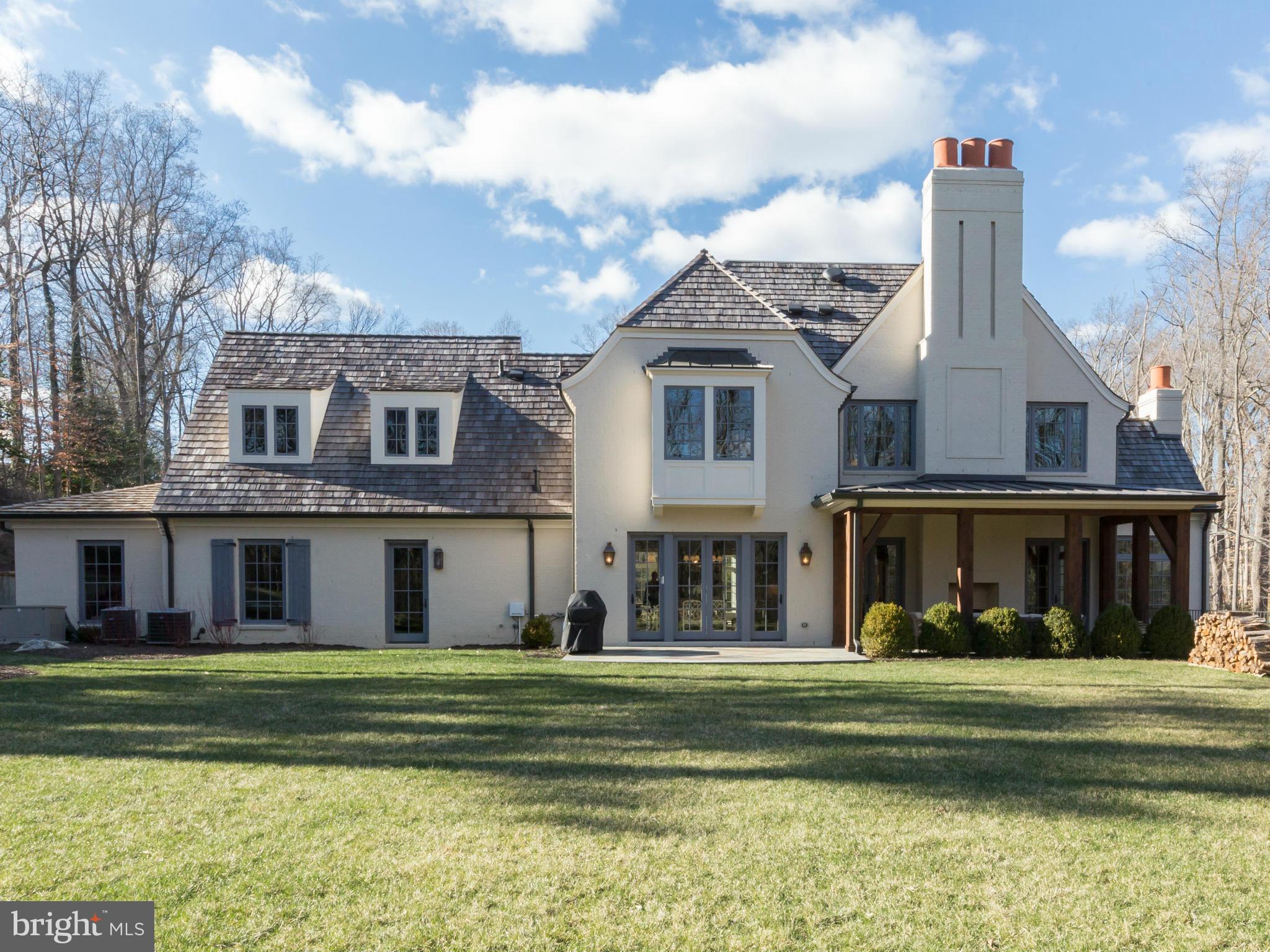 821 Turkey Run Road McLean, VA 22101 - Photo 27 of 30 a front view of a house with a yard table and chairs