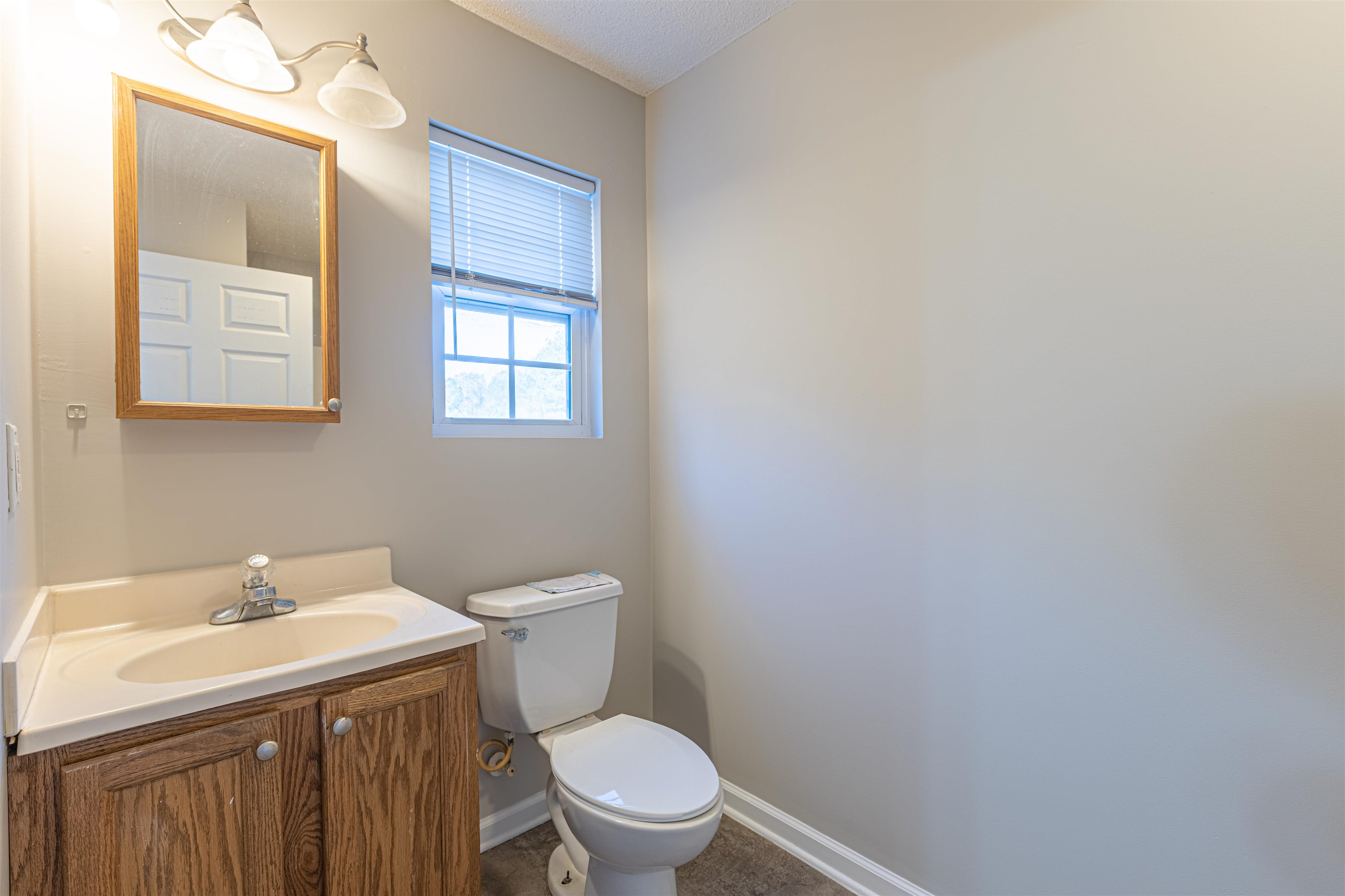 1001 Mistletoe Court Myrtle Beach, SC 29579 - Photo 13 of 28 Kitchen with dishwasher, a chandelier, light countertops, white cabinets, and a textured ceiling