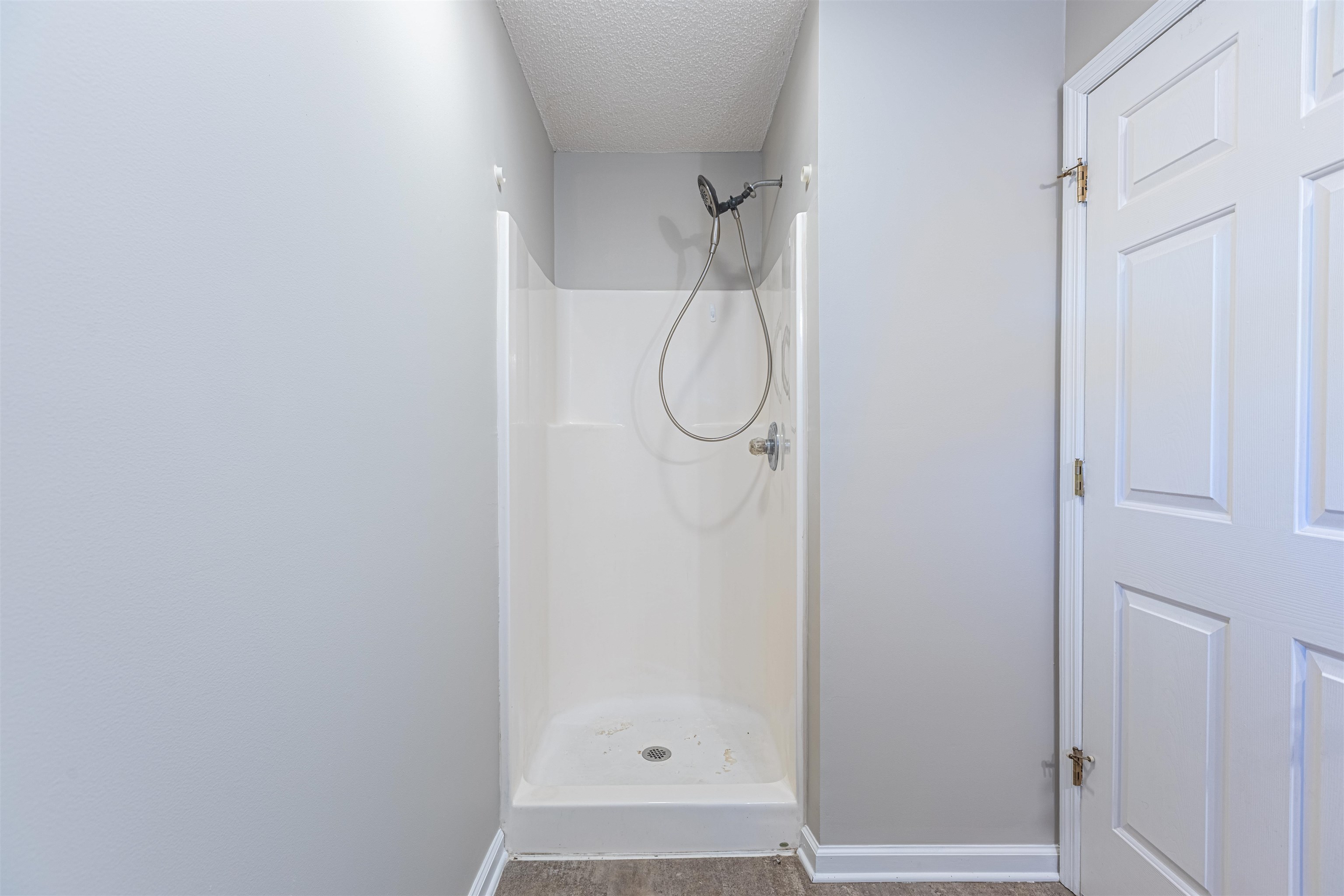 1001 Mistletoe Court Myrtle Beach, SC 29579 - Photo 14 of 28 Unfurnished bedroom featuring a textured ceiling, light wood-style flooring, and a ceiling fan