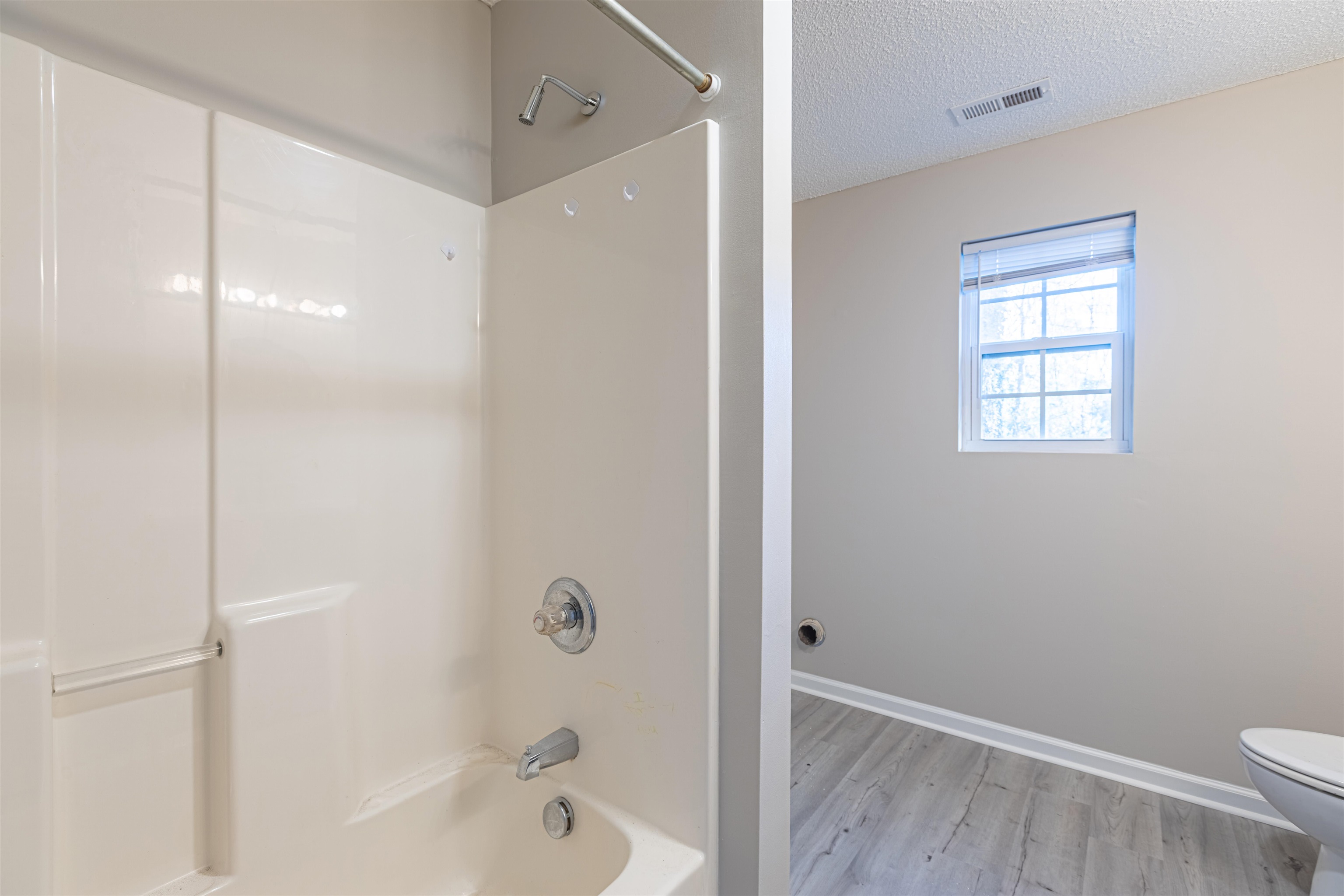 1001 Mistletoe Court Myrtle Beach, SC 29579 - Photo 18 of 28 Bathroom with a textured ceiling and a shower stall
