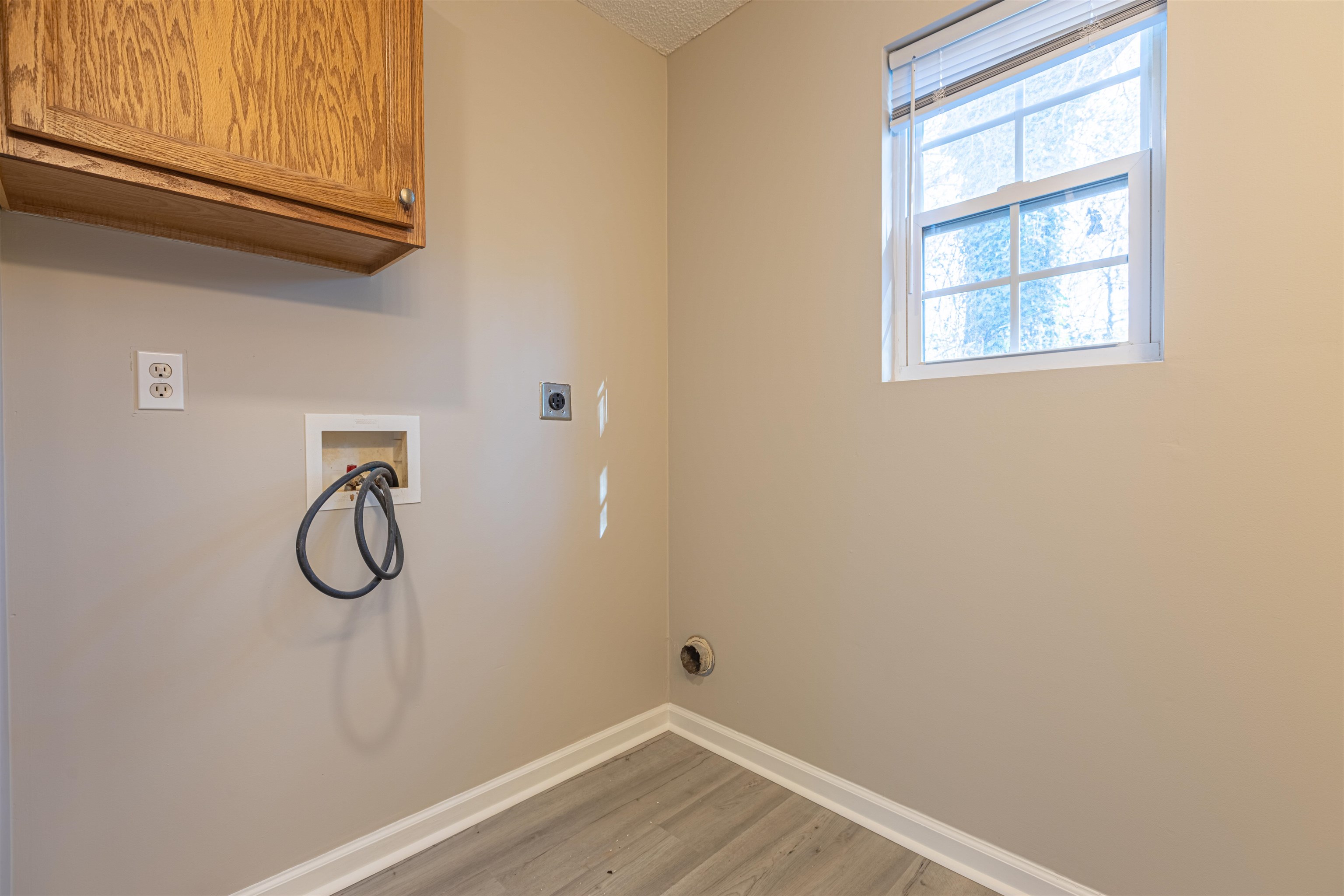 1001 Mistletoe Court Myrtle Beach, SC 29579 - Photo 19 of 28 Empty room featuring a textured ceiling, dark wood-style flooring, and a ceiling fan