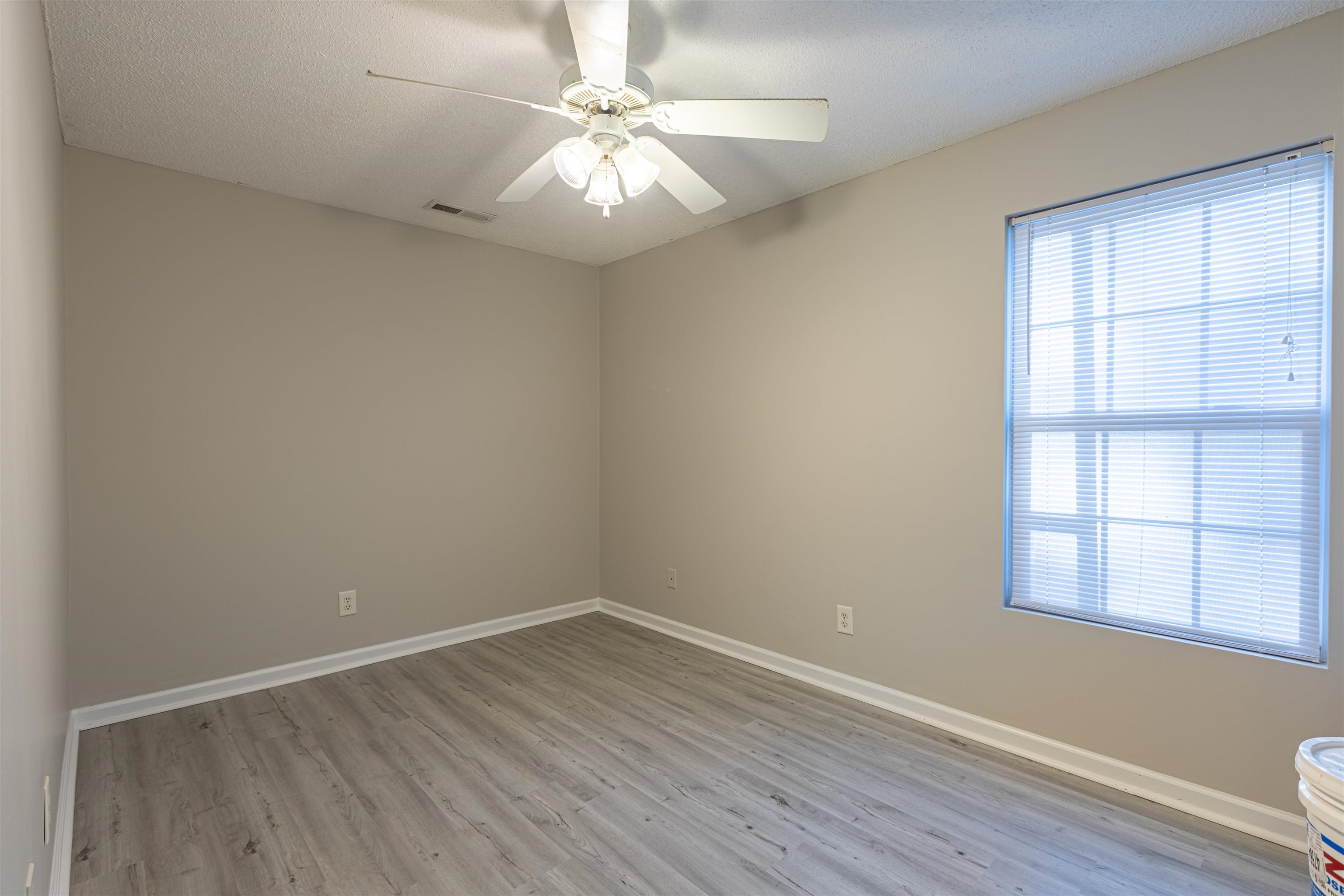 1001 Mistletoe Court Myrtle Beach, SC 29579 - Photo 21 of 28 Bathroom with vanity, light wood-style flooring, and a textured ceiling