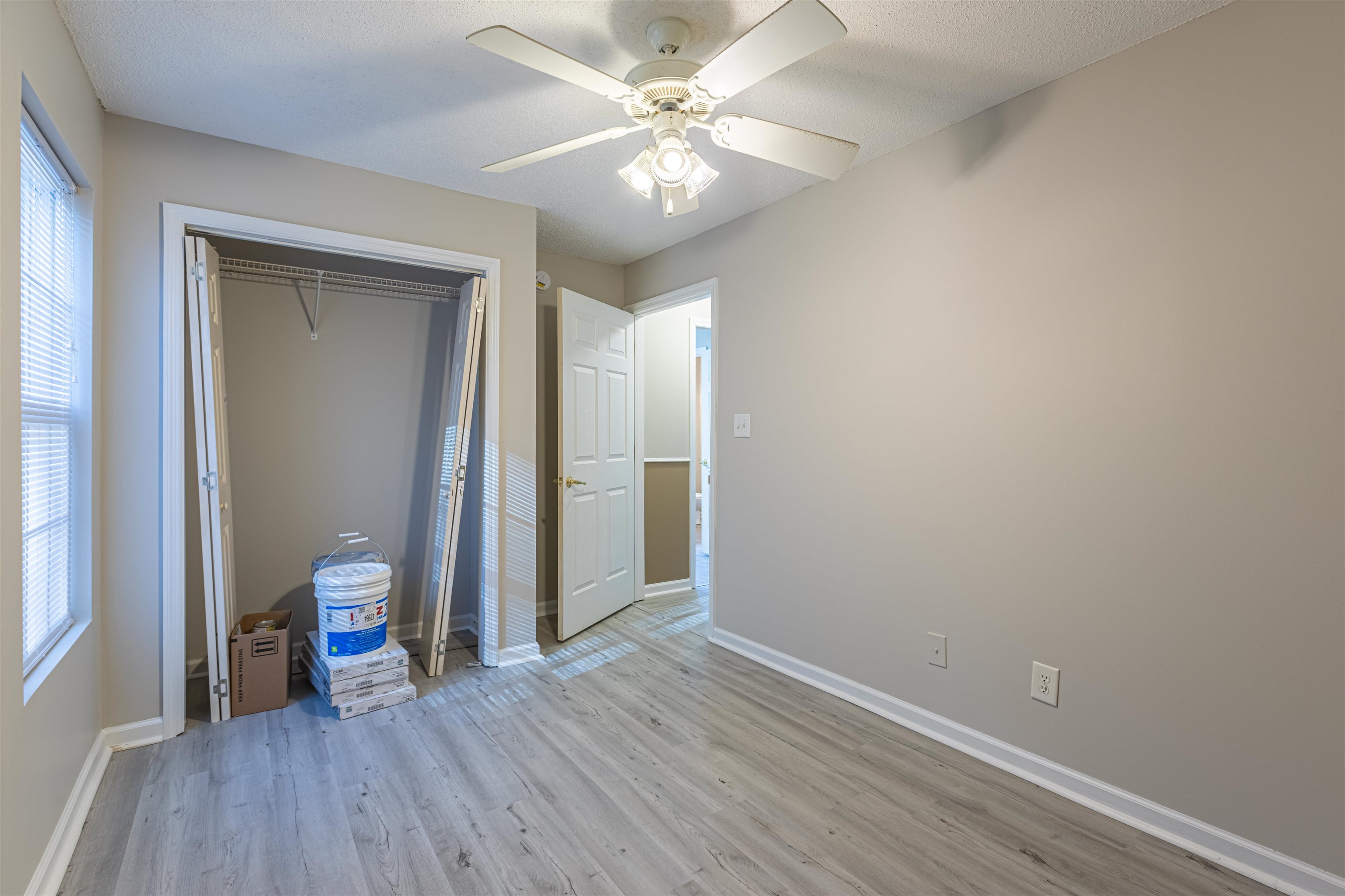 1001 Mistletoe Court Myrtle Beach, SC 29579 - Photo 22 of 28 Bathroom featuring tub / shower combination, a textured ceiling, and light wood-style floors