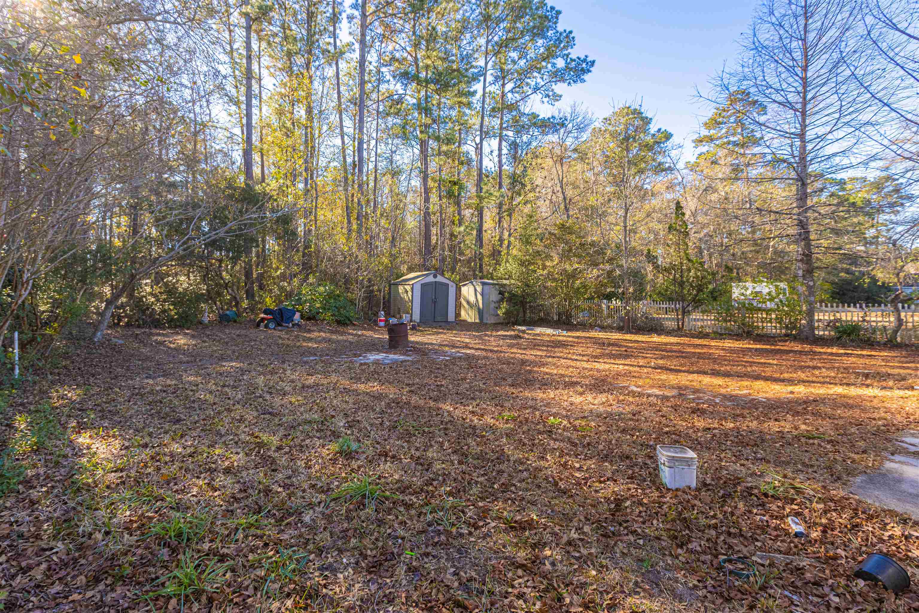 1001 Mistletoe Court Myrtle Beach, SC 29579 - Photo 24 of 28 Empty room featuring a ceiling fan, light wood finished floors, and a textured ceiling