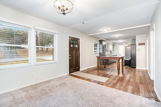 a view of kitchen with furniture and window