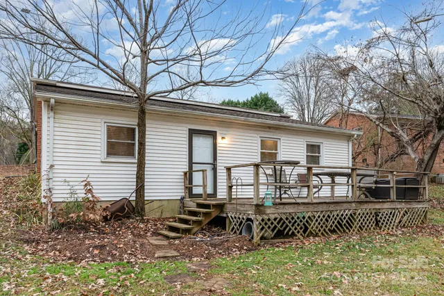 a house with trees in the background