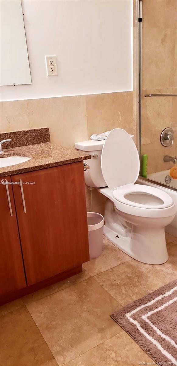 Normandy Isle Miami Beach, FL 33141 - Photo 11 of 12 a bathroom with a toilet and a sink
