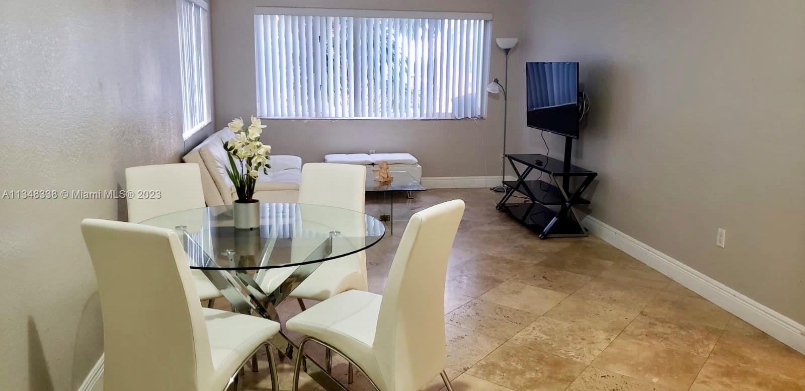 Normandy Isle Miami Beach, FL 33141 - Photo 6 of 12 a view of a workspace with furniture