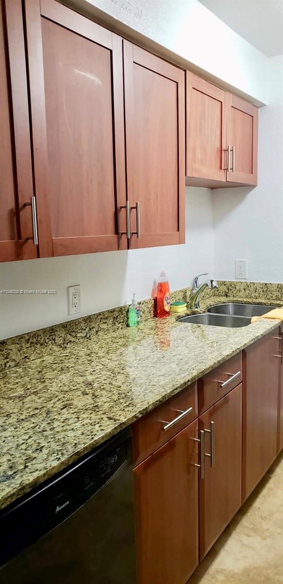 Normandy Isle Miami Beach, FL 33141 - Photo 9 of 12 a bathroom with a granite countertop sink and a mirror