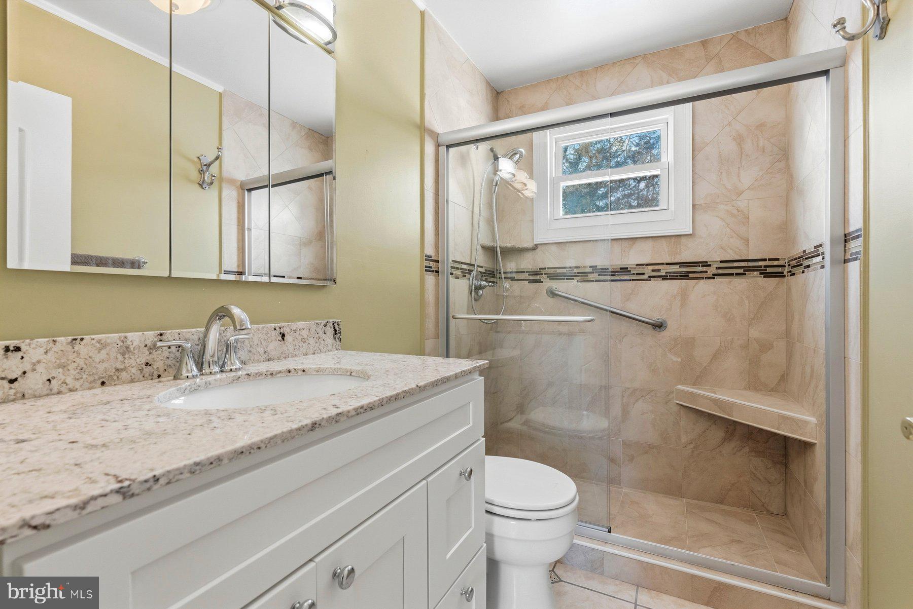 109 Ridgefield Road Lutherville-Timonium, MD 21093 - Photo 16 of 31 a bathroom with a granite countertop sink mirror vanity and toilet
