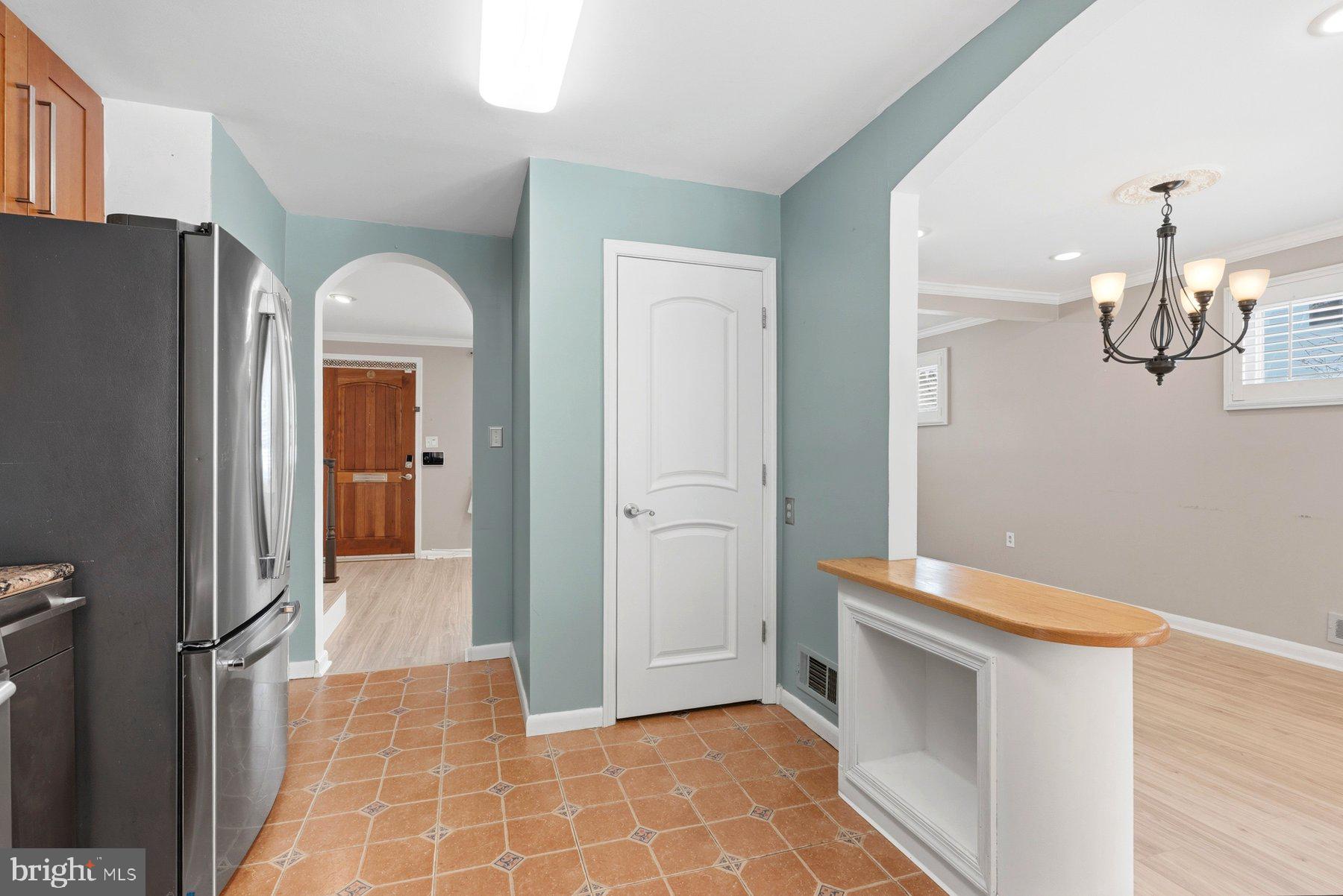 109 Ridgefield Road Lutherville-Timonium, MD 21093 - Photo 8 of 31 a view of a kitchen from the hallway