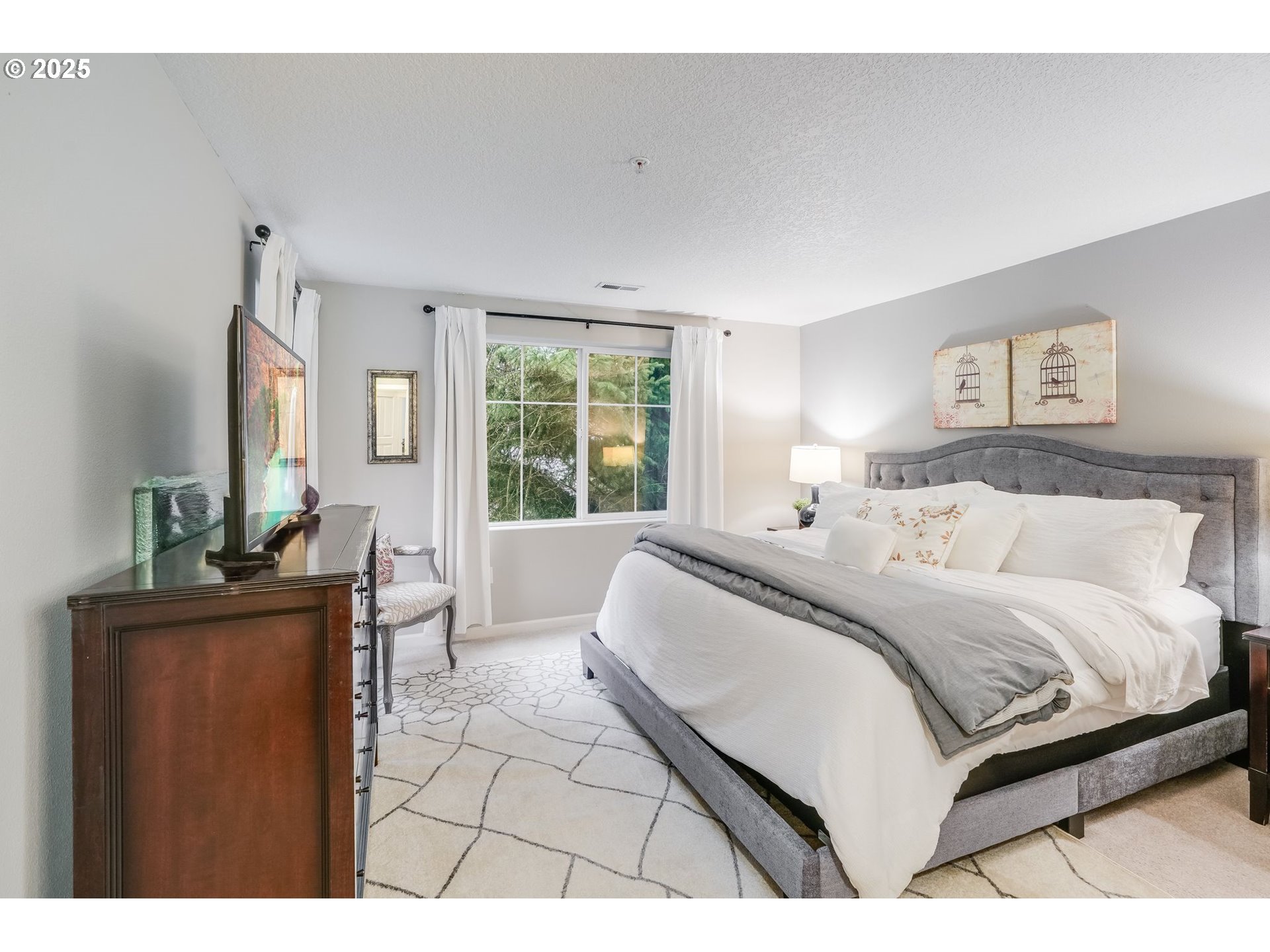 10797 Southwest Canterbury Lane, Unit 101 Portland, OR 97224 - Photo 14 of 28 Primary Bedroom