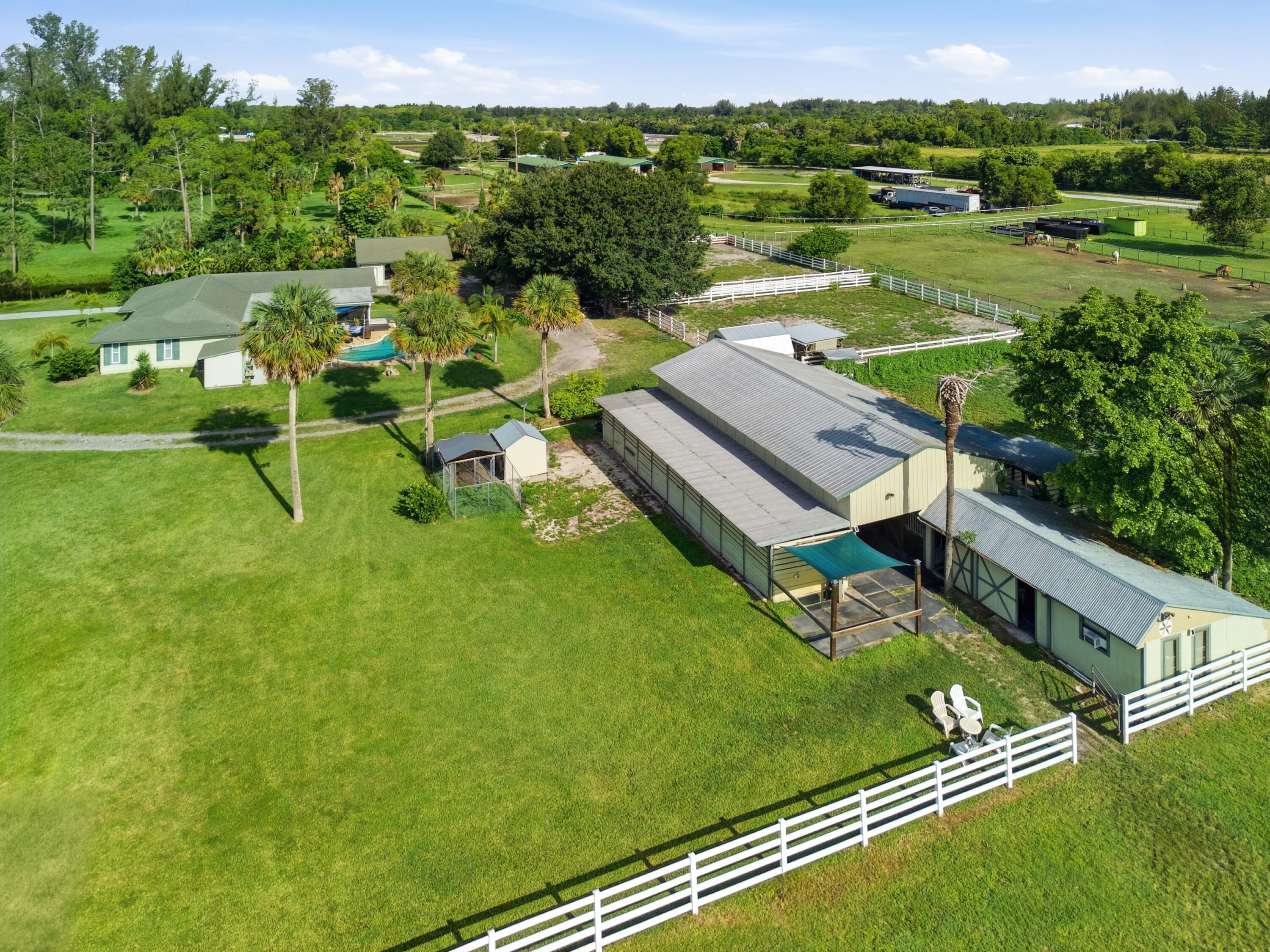 14095 Biddex Road Loxahatchee Groves, FL 33470 - Photo 64 of 69 an aerial view of a golf course with chairs