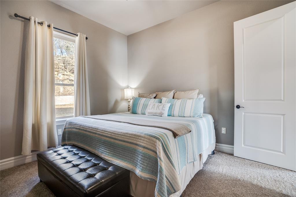 181 Ridgeline Drive Chico, TX 76431 - Photo 20 of 39 a bedroom with a bed and a window