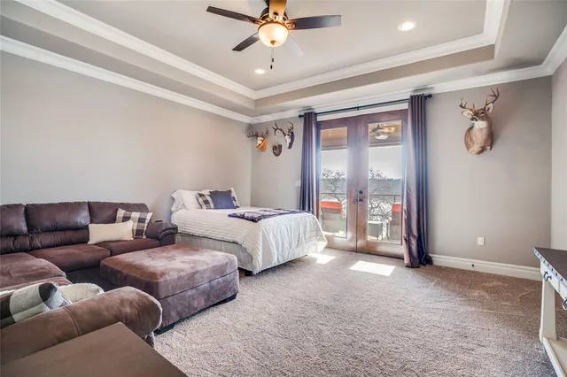 a bedroom with furniture and a ceiling fan