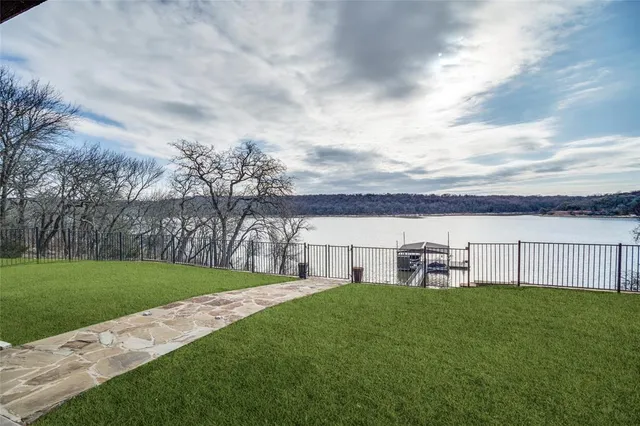 a view of a house with a yard and sitting area