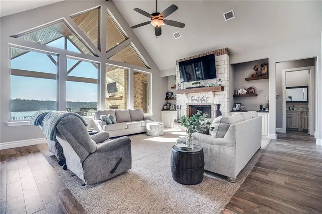 a living room with fireplace furniture and a flat screen tv
