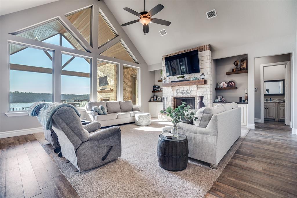 181 Ridgeline Drive Chico, TX 76431 - Photo 5 of 39 a living room with fireplace furniture and a flat screen tv