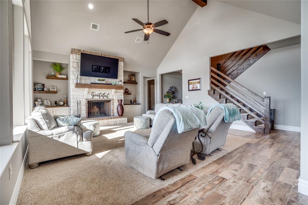 181 Ridgeline Drive Chico, TX 76431 - Photo 6 of 39 a living room with furniture and a fireplace