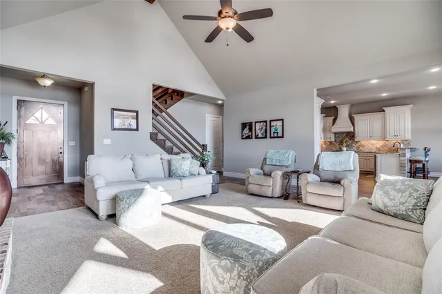 a living room with furniture and a large mirror