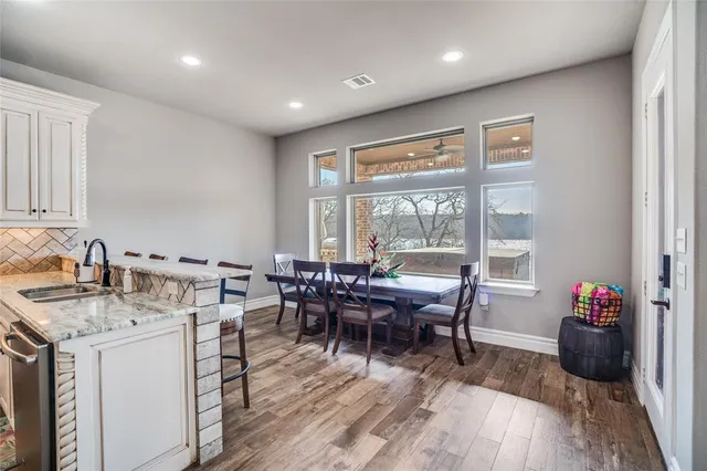 a view of a dining room with furniture window and outside view