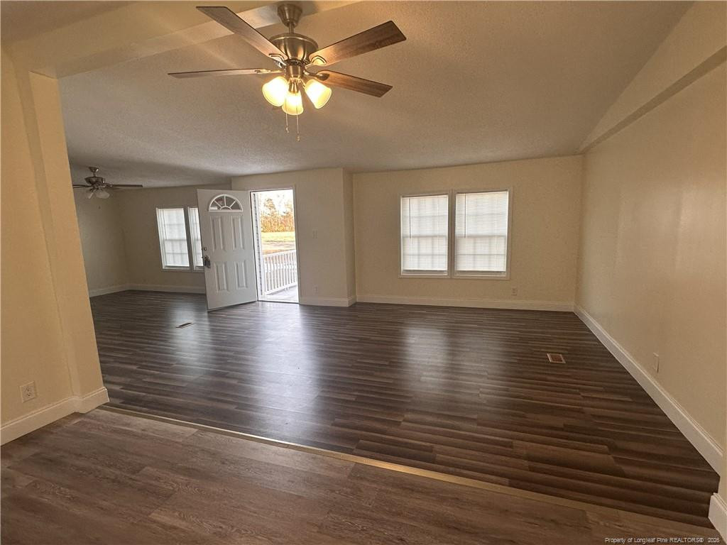 542 Red Oak Farm Road Tar Heel, NC 28392 - Photo 11 of 15 an empty room with wooden floor and window