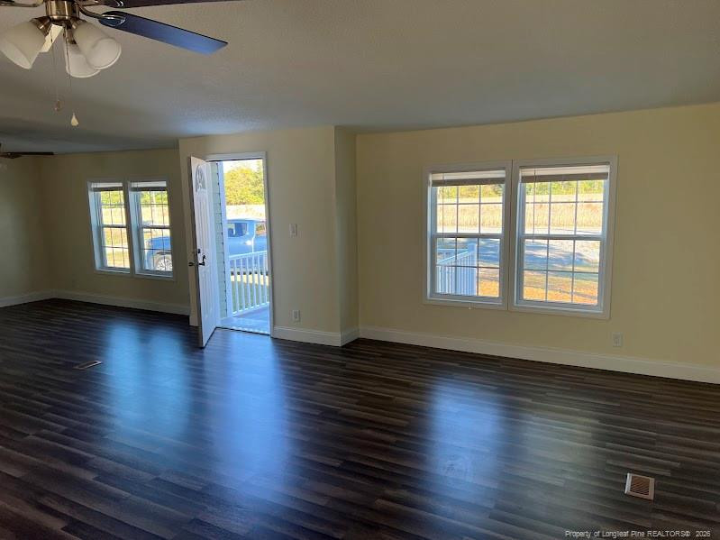 542 Red Oak Farm Road Tar Heel, NC 28392 - Photo 6 of 15 an empty room with wooden floor and windows