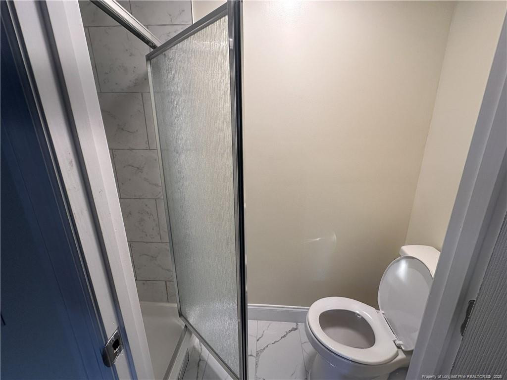 542 Red Oak Farm Road Tar Heel, NC 28392 - Photo 9 of 15 a bathroom with a sink and a toilet