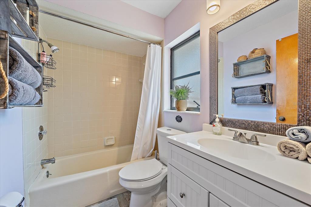 108 Stanford Road Venice, FL 34293 - Photo 16 of 28 a bathroom with a sink toilet and shower
