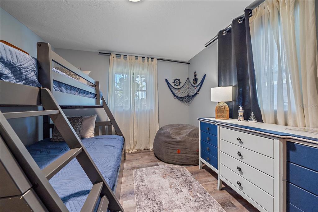 108 Stanford Road Venice, FL 34293 - Photo 18 of 28 a living room with furniture and a window