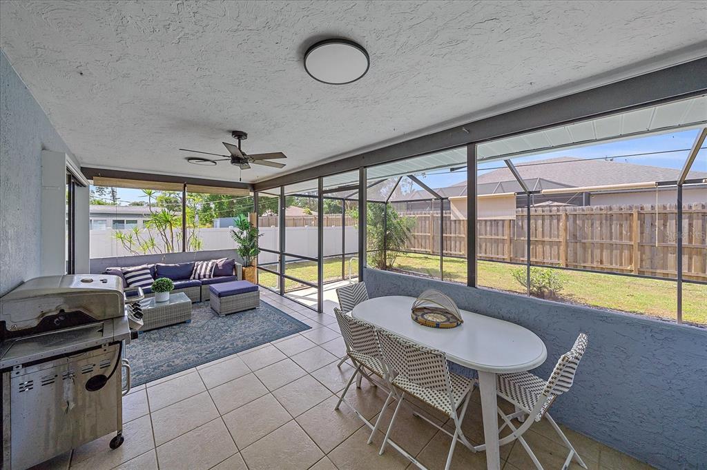 108 Stanford Road Venice, FL 34293 - Photo 23 of 28 a living room with furniture and a large window