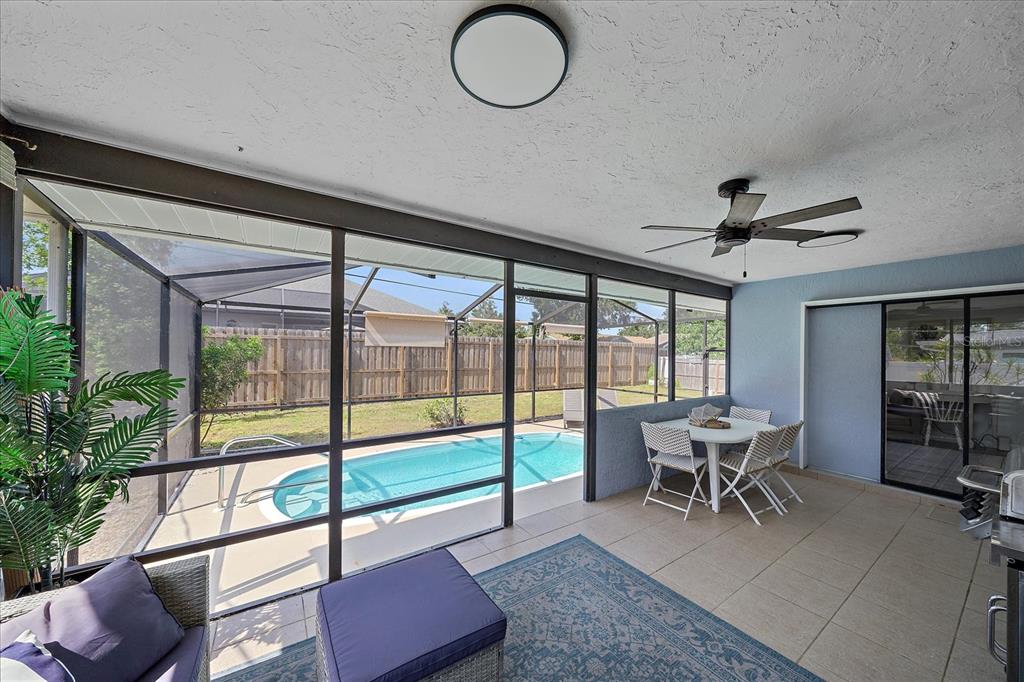 108 Stanford Road Venice, FL 34293 - Photo 24 of 28 a view of a livingroom with furniture and floor to ceiling window