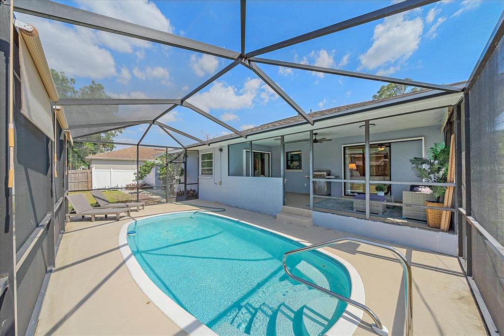 108 Stanford Road Venice, FL 34293 - Photo 26 of 28 a view of a house with pool and chairs